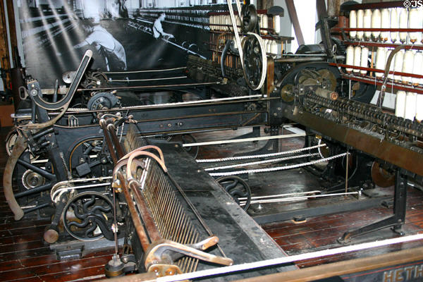 Hetherington Spinning Mule in expanded position where child labor once worked under mechanism fetching broken threads. Pawtucket, RI.