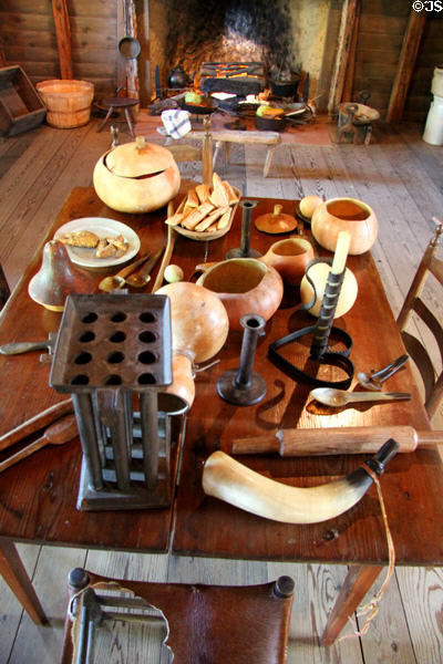 Table with gourds, candle mold & adjustable height candlestick in Old Place at Sam Houston Park. Houston, TX.