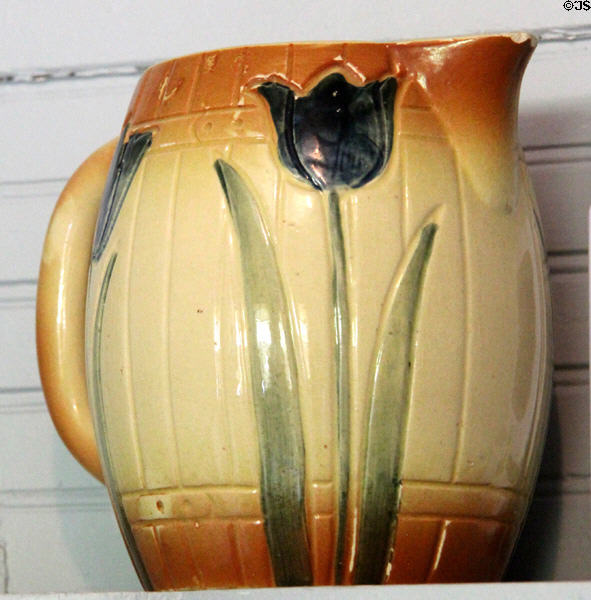 Stoneware pitcher with tulip design at Chambers House Museum. Beaumont, TX.
