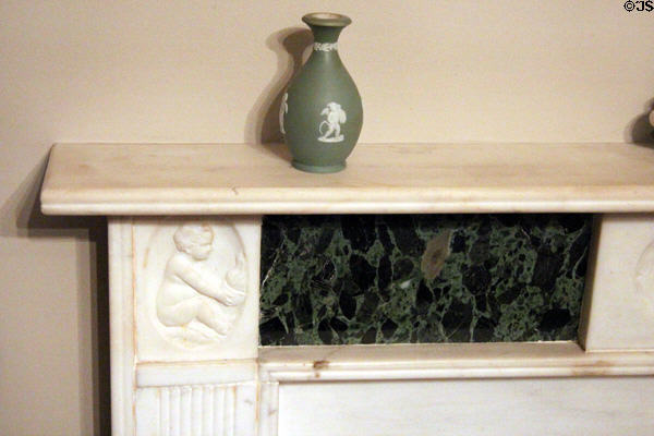 Carved marble mantelpiece with cameo-style vase at McCulloch House. Waco, TX.