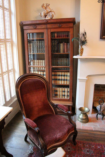 Bookcase & armchair at East Terrace House. Waco, TX.