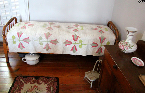 Bedroom with quilt at East Terrace House. Waco, TX.