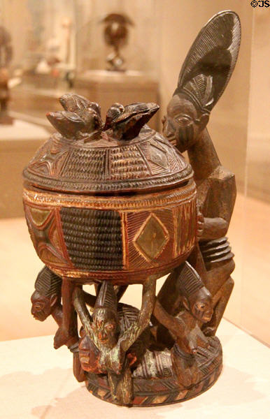 Wood kneeling female figure with bowl (early 20thC) by Ekiti Yoruba culture of Southwestern Nigeria at Dallas Museum of Art. Dallas, TX.