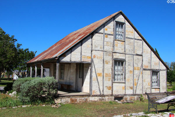 The Morhrig-Blank Ranch House (1855) made of cut limestone blocks at Conservation Plaza. New Braunfels, TX.