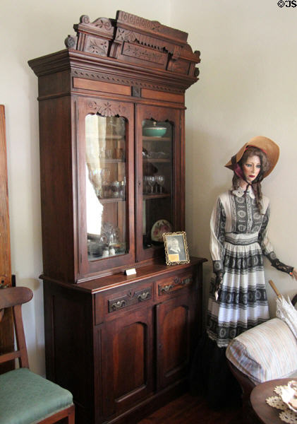 Decoratively carved cupboard in Jahn House at Conservation Plaza. New Braunfels, TX.