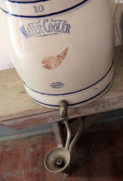 Stoneware water cooler with drinking fountain in Church Hill School at Conservation Plaza. New Braunfels, TX.