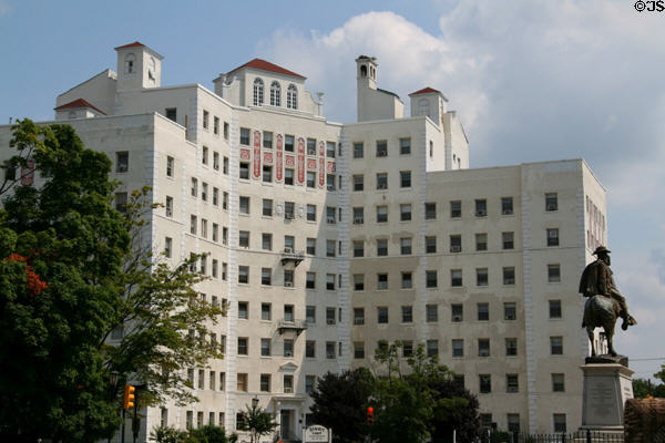 J.E.B. Stuart monument with Stuart Court Apartment building beyond on Monument Ave. Richmond, VA.