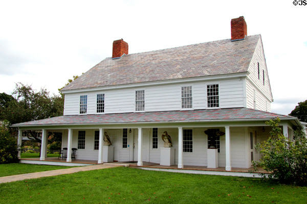 Folk arts pieces on verandah of Stagecoach Inn at Shelburne Museum. Shelburne, VT.