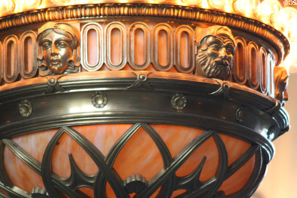 Ring of faces on Tiffany's dome chandelier in Washington State Capitol. Olympia, WA.