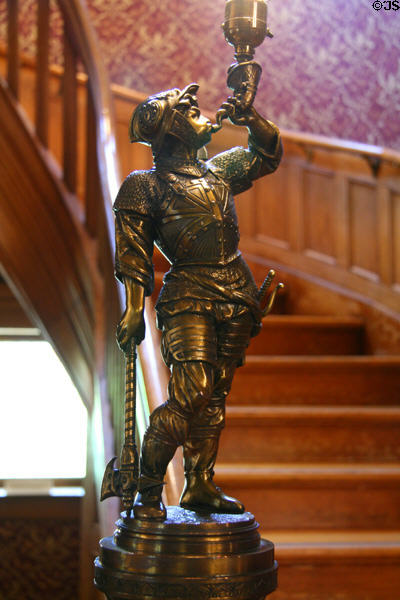 Brass knight lamp on newel post of Laramie Plains Museum. Laramie, WY.