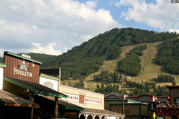 Frontier style buildings of Jackson against surrounding hills. Jackson, WY.