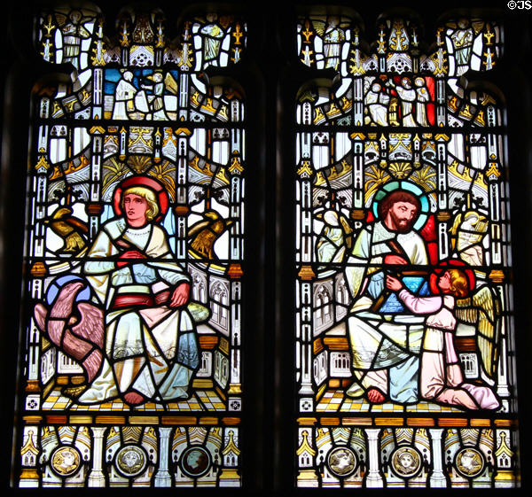 Stained glass windows with Evangelists Mark with lion & Luke with bull at Cardiff Castle. Cardiff, Wales.