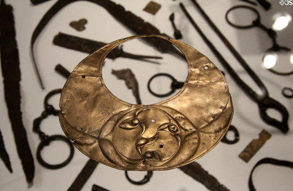 Crescentic-shaped bronze plaque (200 BCE-50 BCE) decorated with Celtic or La Tène art design at St Fagans National Museum of History. Cardiff, Wales.