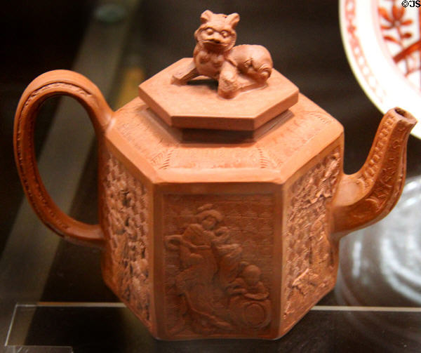 Stoneware teapot (1760-5) with figure on lid from Staffordshire at National Museum of Wales. Cardiff, Wales.