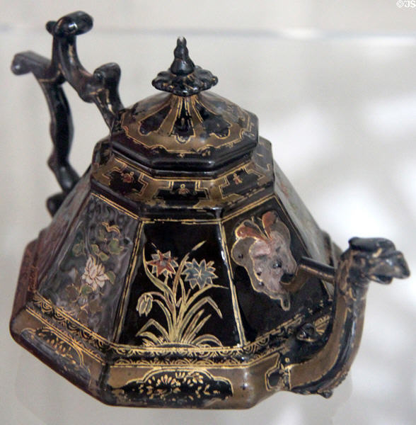 Stoneware multi-sided teapot (1710-20) with different design on each side & dragon spout, glazed to imitate lacquer, by Böttger for Meissen Porcelain Manuf. of Germany at National Museum of Wales. Cardiff, Wales.