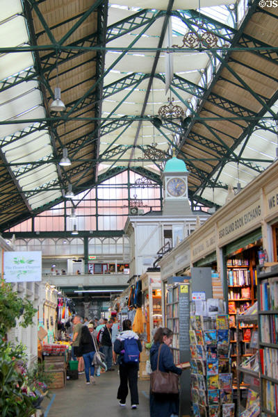 Shoppers in glassed roofed Cardiff Market in Cardiff City Centre. Cardiff, Wales.