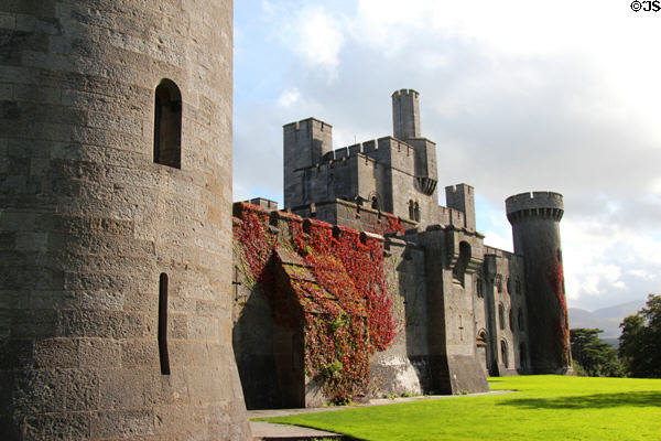 Penrhyn Castle (1820-37) reconstructed after earlier buildings on the site as a country home in the style of a Norman castle (neo-Norman). Bangor, Wales. Style: Romanesque Revival. Architect: Thomas Hopper (reconstruction).