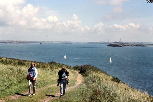 Walkers along coastal trail in Pembrokeshire. Wales.