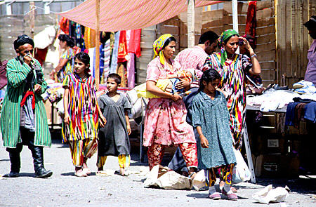 Traditional dress at the market in Bukhara. Uzbekistan.