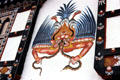 Demon-like mural on side of house in Paro. Bhutan.