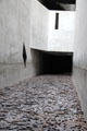 Symbolic faces of victims in void at Jewish Museum Berlin. Berlin, Germany.