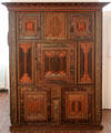 Carved & painted Renaissance-influenced Germanic cupboard with linen-fold panels at Schleswig Holstein State Museum. Schleswig, Germany.