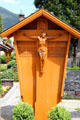 Carved grave marker at St Peter & Paul church. Oberammergau, Germany.