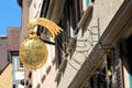 Gilded bread shop sign in Market Area. Ulm, Germany.
