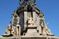 Figures of representing realms of Spain plus medallions of people connected with Columbus at base of Columbus Monument. Barcelona, Spain.