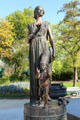 Woman with flame & child with newspaper hat statue at Monument of Human Rights on Champs de Mars. Paris, France.