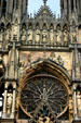 Facade side of rose window on Cathedral which has been rebuilt since total destruction in World War I. Reims, France.