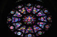 Christ with evangelists stained glass rose window in Cathedral. Reims, France.