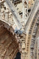 Rhinoceros gargoyle among carvings on Reims Cathedral. Reims, France.