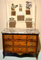 Collection of French silver over French commode at Orleans Beaux Arts Museum. Orleans, France.