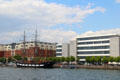 Jeanie Johnstone Tall Ship before modern buildings on River Liffey. Dublin, Ireland.