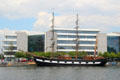 Jeanie Johnstone Tall Ship docked in front of CITI building on River Liffey. Dublin, Ireland.