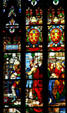 Carrying image of Christ in stained-glass of Duomo. Milan, Italy.