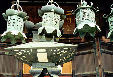 Metal temple lanterns hang in Nara. Japan.