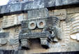 Detail of a fanged mask sculpture on Temple of Quetzalcoatl at Teotihuacán. Mexico.
