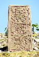 Stella carved with reliefs of figures & animals in Monte Albán in hills above Oaxaca. Mexico