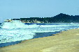 Crashing waves on beach at Manialtepec. Mexico.
