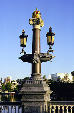 Ornate street lamps on Blauwbrung bridge near opera. Amsterdam, Netherlands.