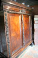 Large cabinet placed next to doorway typical of farmhouse from Staphorst are at Arnhem Openlucht Museum. Arnhem, Netherlands.