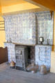 Delft tile fireplace surround inset with coal stove at Arnhem Openlucht Museum. Arnhem, Netherlands.