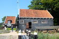 Work shed with sign for tar & grease at Arnhem Openlucht Museum. Arnhem, Netherlands.