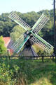 Windmill in pastoral setting at Arnhem Openlucht Museum. Arnhem, Netherlands.