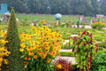 Flowering plants in lower garden with Celestial Sphere in the background. Het Loo, Netherlands.