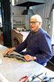 Artisan with his tools at National Tin Figure Museum. Ommen, Netherlands.