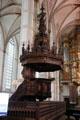 Ornately carved wood pulpit built by Straes van Weilborch, in St. Michael's Church now called Academie huis Grote Kirk Zwolle at St. Michael's Church. Zwolle, Netherlands.