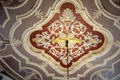 Decorative ceiling medallion, including golden eagle, from which hangs lighting fixture at St. Michael's Church. Zwolle, Netherlands.